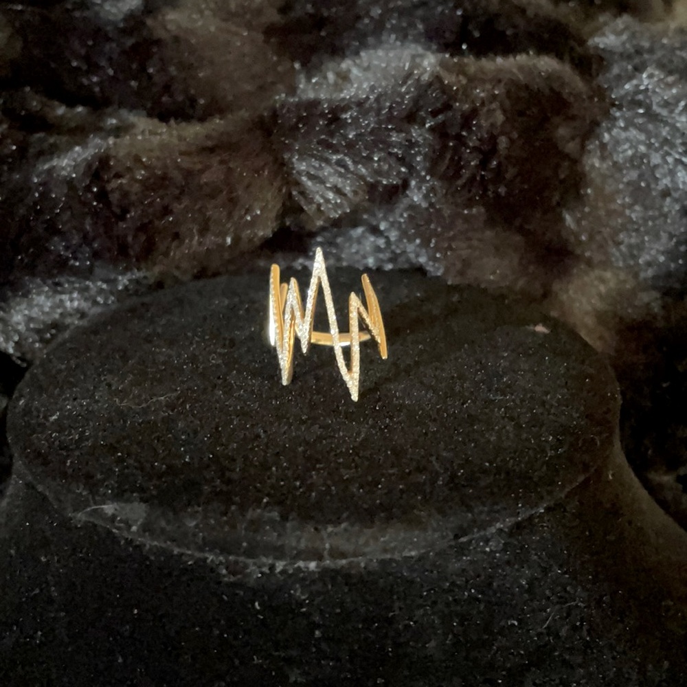14 gold and diamond pinkie ring.